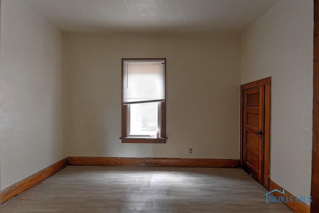 452 E Park St, Toledo, OH 43608 - empty room with baseboards and wood finished floors
