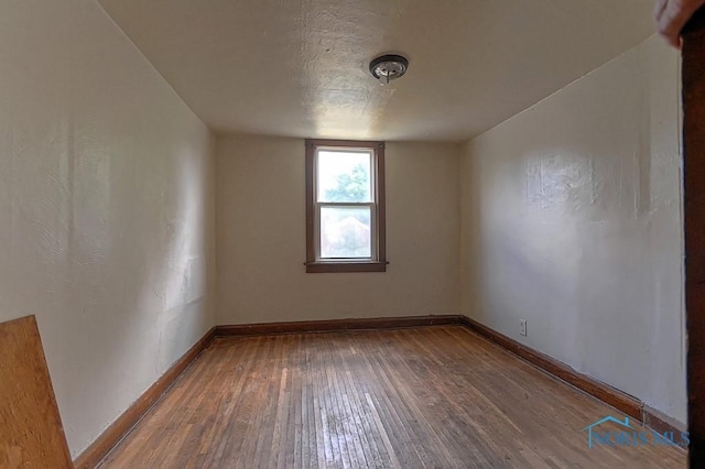 452 E Park St, Toledo, OH 43608 - empty room featuring hardwood / wood-style floors and baseboards