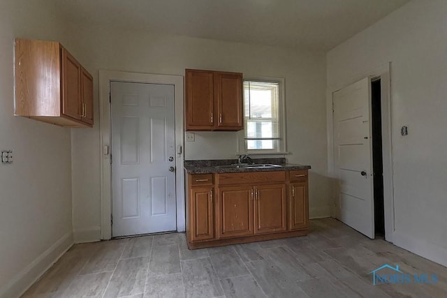 452 E Park St, Toledo, OH 43608 - kitchen featuring a sink and brown cabinets