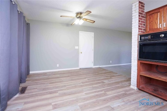 601 Edith Ave, Findlay, OH 45840 - kitchen with oven, light wood-style flooring, a ceiling fan, and brown cabinets