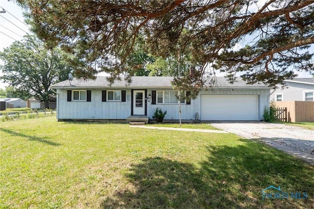 601 Edith Ave, Findlay, OH 45840 - ranch-style house with concrete driveway, an attached garage, and board and batten siding