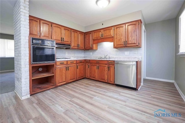 601 Edith Ave, Findlay, OH 45840 - kitchen with dishwasher, oven, light countertops, and brown cabinets