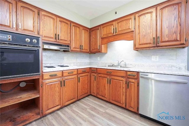 601 Edith Ave, Findlay, OH 45840 - kitchen with dishwasher, black oven, brown cabinets, and decorative backsplash