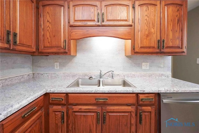601 Edith Ave, Findlay, OH 45840 - kitchen featuring dishwasher, light countertops, and brown cabinetry