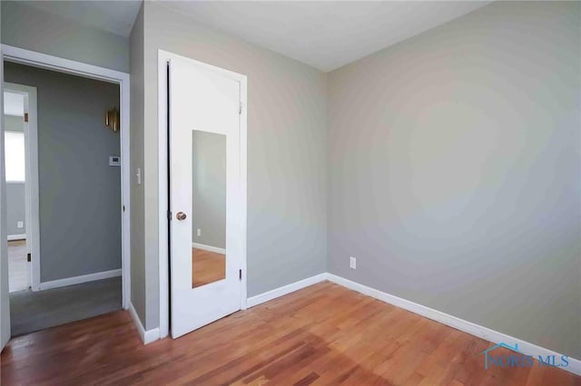 601 Edith Ave, Findlay, OH 45840 - unfurnished bedroom featuring wood finished floors and baseboards