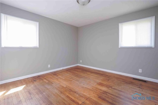 601 Edith Ave, Findlay, OH 45840 - spare room featuring healthy amount of natural light and wood finished floors