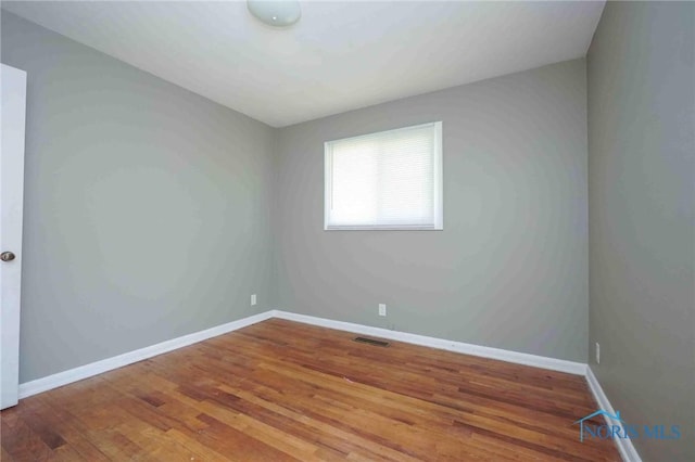 601 Edith Ave, Findlay, OH 45840 - spare room featuring wood finished floors and baseboards