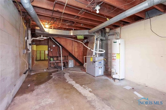 601 Edith Ave, Findlay, OH 45840 - unfinished below grade area with gas water heater, heating unit, and concrete block wall
