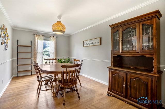 2838 Long View Dr, Maumee, OH 43537 - dining space featuring light wood-style floors and crown molding