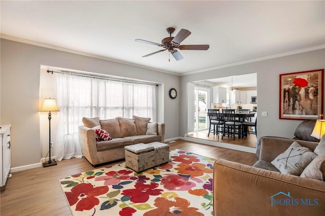 2838 Long View Dr, Maumee, OH 43537 - living room featuring crown molding, a ceiling fan, and light wood-type flooring