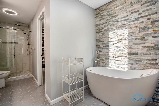 2838 Long View Dr, Maumee, OH 43537 - bathroom featuring a stall shower, tile patterned flooring, a freestanding tub, and a spacious closet
