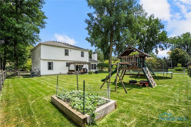 2838 Long View Dr, Maumee, OH 43537 - fenced backyard featuring a trampoline, a playground, and a vegetable garden