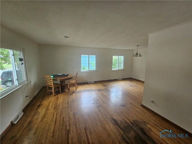 2916 Upton Ave, Toledo, OH 43606 - unfurnished dining area with a chandelier and dark wood-style floors