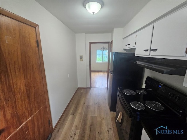 2916 Upton Ave, Toledo, OH 43606 - kitchen with electric range, extractor fan, light wood-style flooring, and white cabinetry