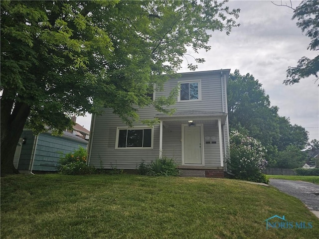 2916 Upton Ave, Toledo, OH 43606 - traditional-style home featuring a front yard