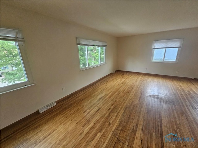 2916 Upton Ave, Toledo, OH 43606 - empty room with wood finished floors and baseboards