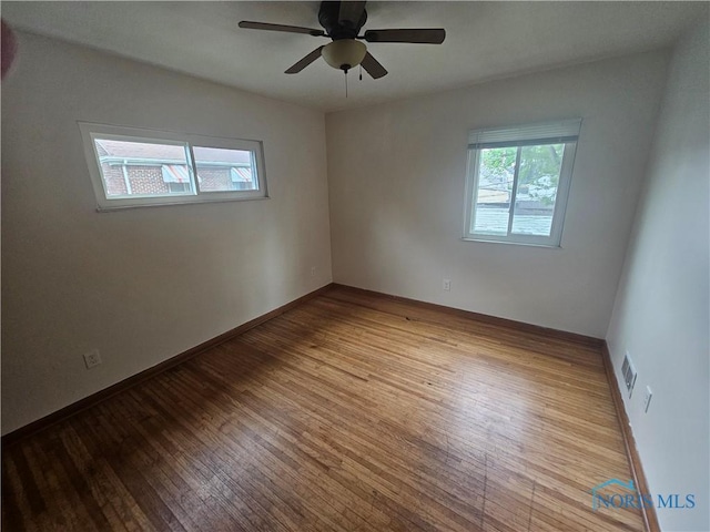 2916 Upton Ave, Toledo, OH 43606 - empty room with wood finished floors and a ceiling fan