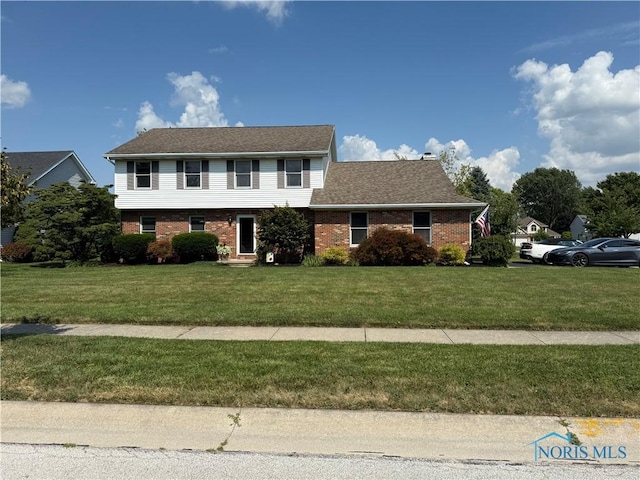 424 Harvest Ct, Waterville, OH 43566 - colonial house featuring brick siding and a front yard