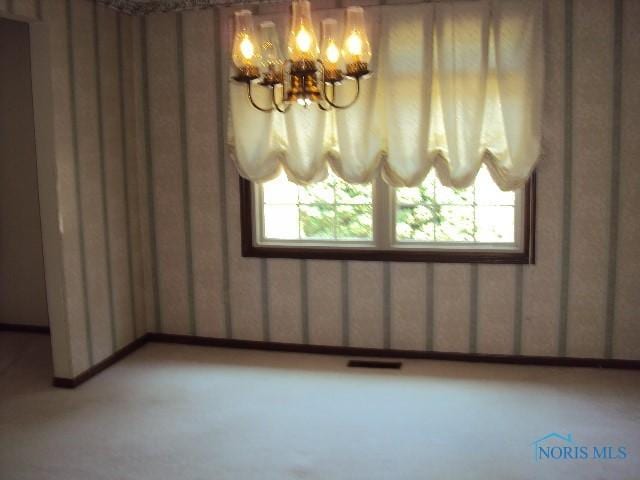 217 Lakeview Dr, Bryan, OH 43506 - spare room with a chandelier