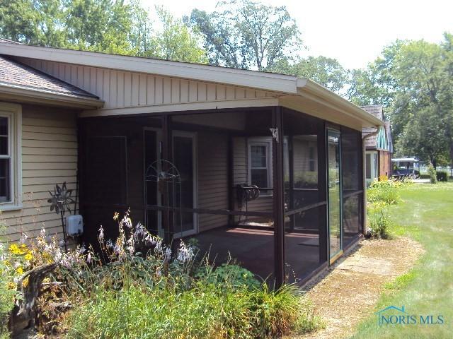 217 Lakeview Dr, Bryan, OH 43506 - view of home's exterior with a sunroom
