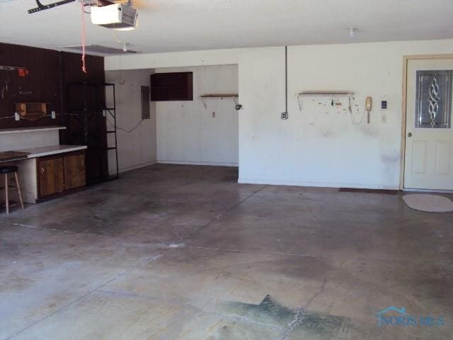 217 Lakeview Dr, Bryan, OH 43506 - garage featuring a garage door opener