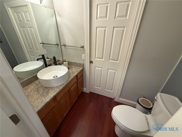 9151 Rolling Hill Rd, Holland, OH 43528 - half bath with vanity and wood finished floors
