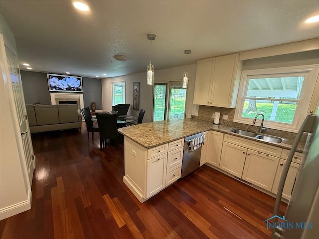 9151 Rolling Hill Rd, Holland, OH 43528 - kitchen featuring dishwasher, dark wood finished floors, a peninsula, white cabinets, and open floor plan