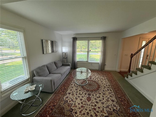 9151 Rolling Hill Rd, Holland, OH 43528 - living room with stairway and baseboards