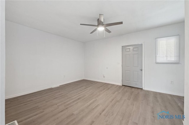 1155 Pinewood Ave, Toledo, OH 43607 - spare room with a ceiling fan and wood finished floors