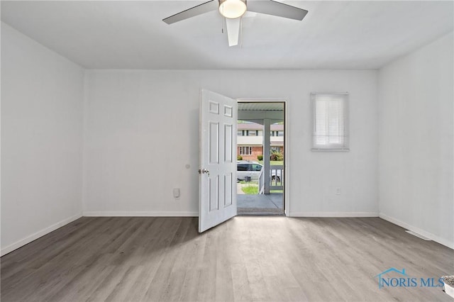 1155 Pinewood Ave, Toledo, OH 43607 - spare room featuring wood finished floors and a ceiling fan