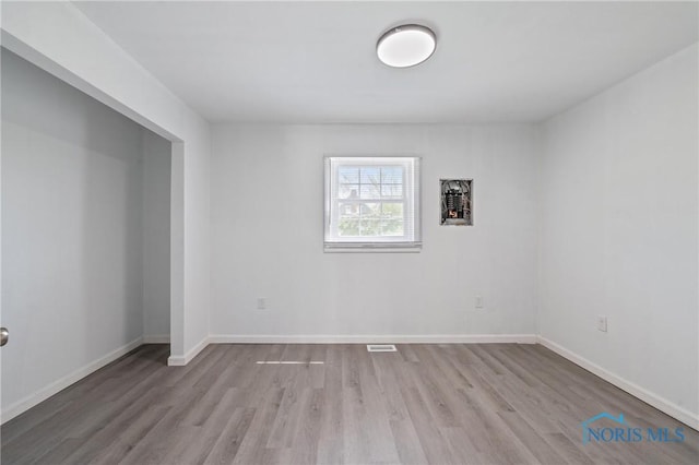 1155 Pinewood Ave, Toledo, OH 43607 - unfurnished room with wood finished floors and baseboards