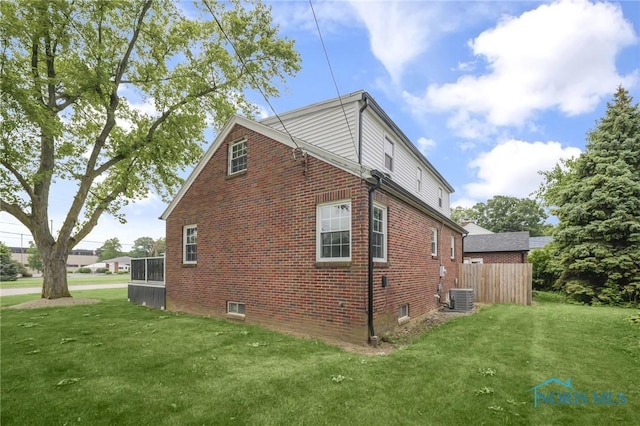 1421 Hurd Ave, Findlay, OH 45840 - view of side of property with brick siding and a yard