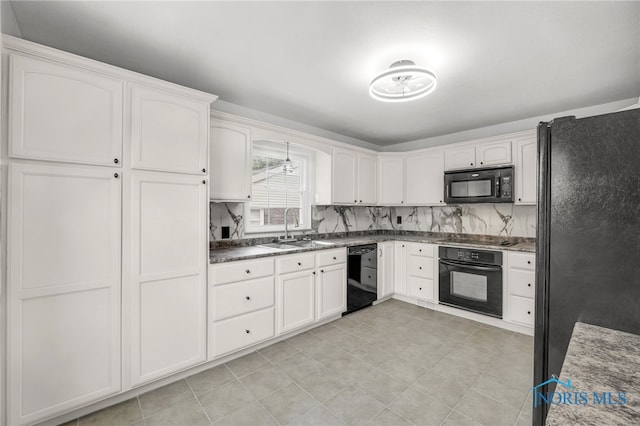 1421 Hurd Ave, Findlay, OH 45840 - kitchen featuring black appliances, white cabinets, dark countertops, light tile patterned floors, and decorative backsplash