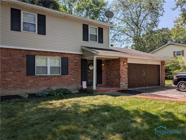 5743 Pinecroft Dr, Toledo, OH 43615 - view of front of property featuring brick siding, a garage, a front lawn, and concrete driveway
