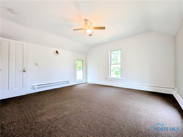 312 S Elm St, Pioneer, OH 43554 - bonus room featuring a baseboard heating unit, vaulted ceiling, ceiling fan, and carpet flooring