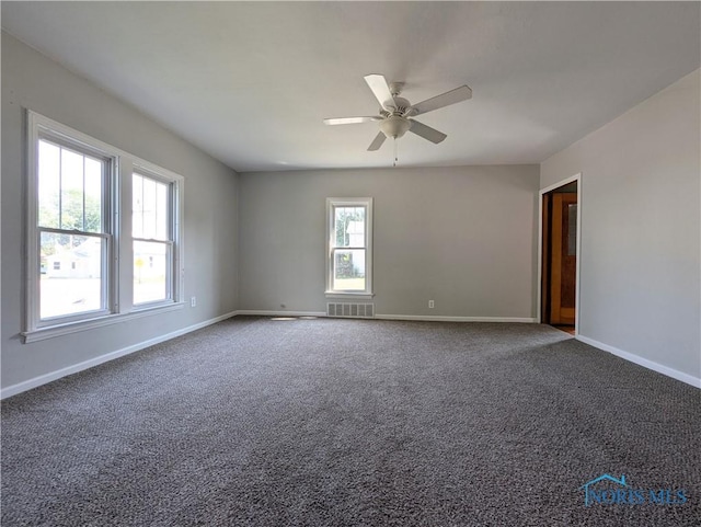 312 S Elm St, Pioneer, OH 43554 - carpeted spare room featuring baseboards and a ceiling fan