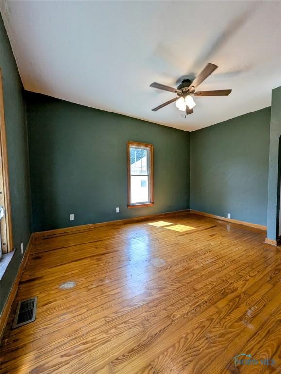 312 S Elm St, Pioneer, OH 43554 - unfurnished room featuring ceiling fan and wood finished floors