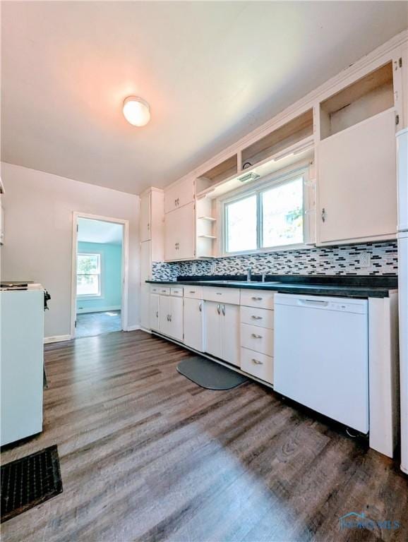 312 S Elm St, Pioneer, OH 43554 - kitchen featuring dishwasher, open shelves, dark countertops, stove, and white cabinets