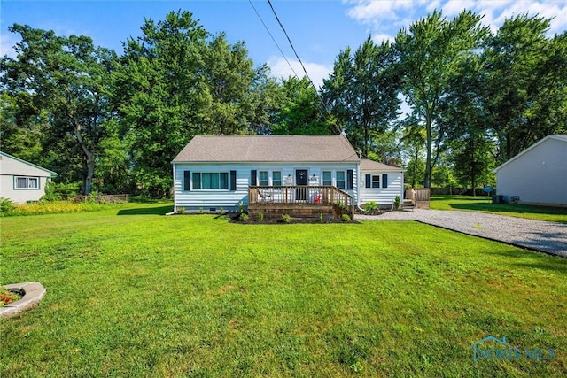 6006 Blossman Rd, Toledo, OH 43617 - view of front facade with a deck, a front yard, and crawl space