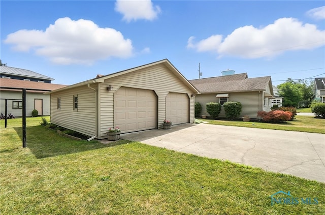 719 S Shannon St, Van Wert, OH 45891 - view of front facade with an outdoor structure, a front yard, and a detached garage
