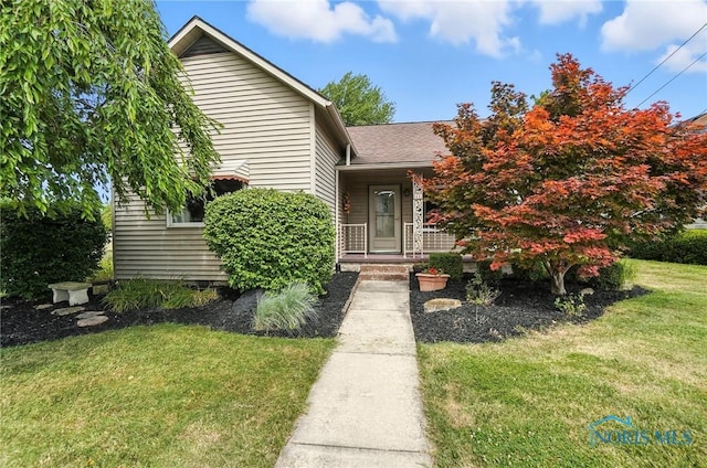 719 S Shannon St, Van Wert, OH 45891 - view of front facade featuring a front lawn and roof with shingles