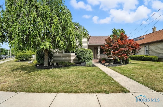 719 S Shannon St, Van Wert, OH 45891 - view of property hidden behind natural elements with a front lawn and covered porch
