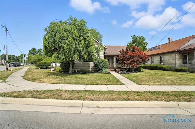 719 S Shannon St, Van Wert, OH 45891 - view of property hidden behind natural elements featuring a front yard