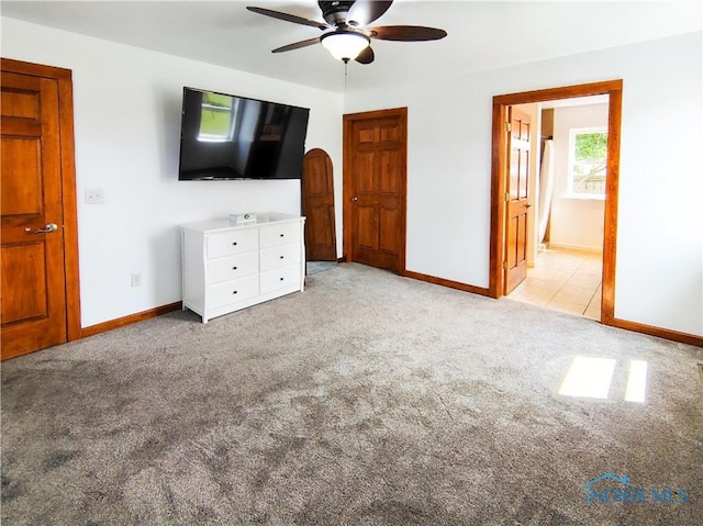 15740 Hill Rd, Defiance, OH 43512 - unfurnished bedroom featuring carpet, connected bathroom, and ceiling fan
