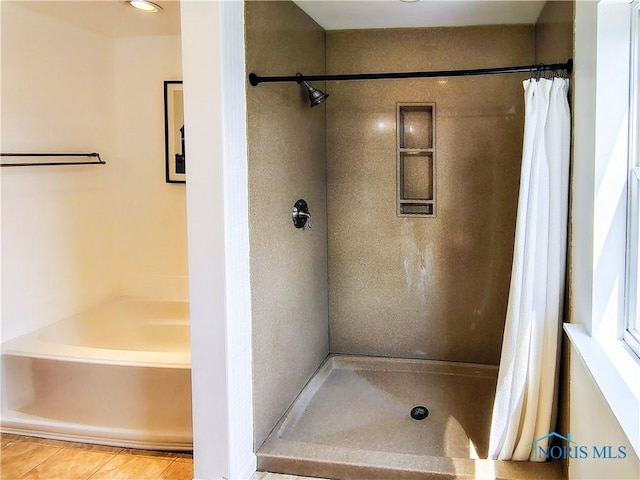 15740 Hill Rd, Defiance, OH 43512 - full bath with a shower with curtain, a bath, and tile patterned flooring