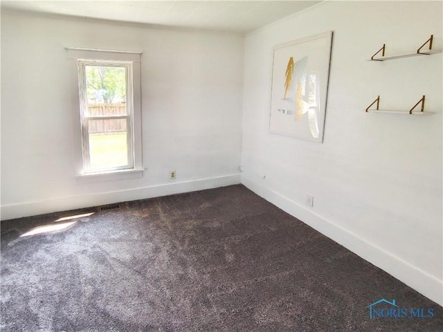 15740 Hill Rd, Defiance, OH 43512 - unfurnished room with dark colored carpet and baseboards