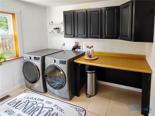 15740 Hill Rd, Defiance, OH 43512 - laundry room featuring cabinet space, independent washer and dryer, and light tile patterned floors