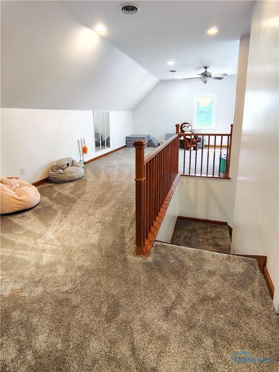15740 Hill Rd, Defiance, OH 43512 - stairway featuring carpet floors, vaulted ceiling, ceiling fan, and recessed lighting