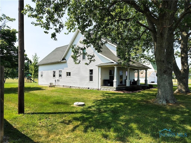 15740 Hill Rd, Defiance, OH 43512 - rear view of property featuring a porch and a lawn