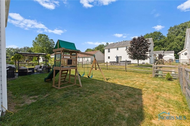 606 Niagara Ave, Holland, OH 43528 - fenced backyard featuring a playground